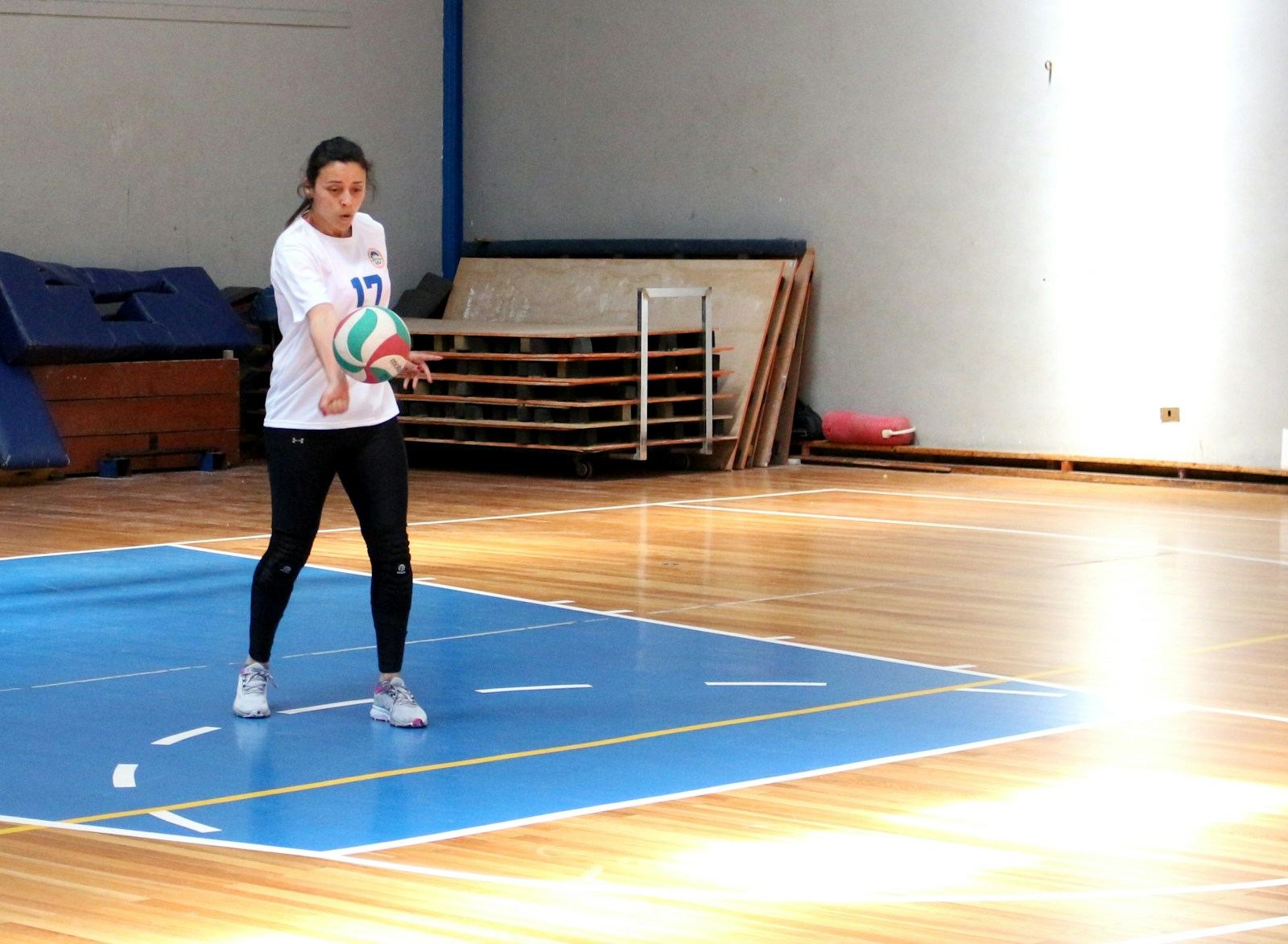 Player passing on a wood court